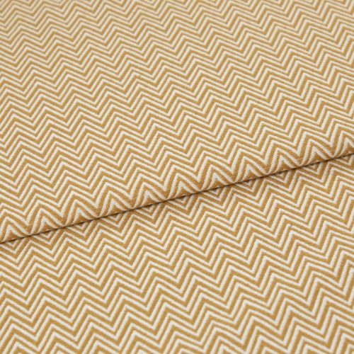 Mustard-and-white chevron fabric, tightly woven, folded across the frame; pattern repeats in narrow zigzags. Close-up view showing textured weave and soft, even lighting on a flat surface.