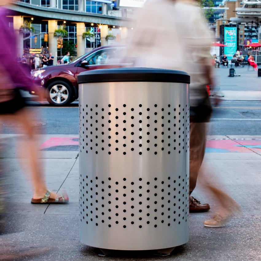 silver and black outdoor durable trash bin with a canopy lid to keep rain and snow from contaminating contents