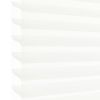 White pleated cellular blind with scalloped left edge, lowered and filtering soft daylight; occupies most of the frame, suggesting a bright interior with diffused light and no visible outside view.
