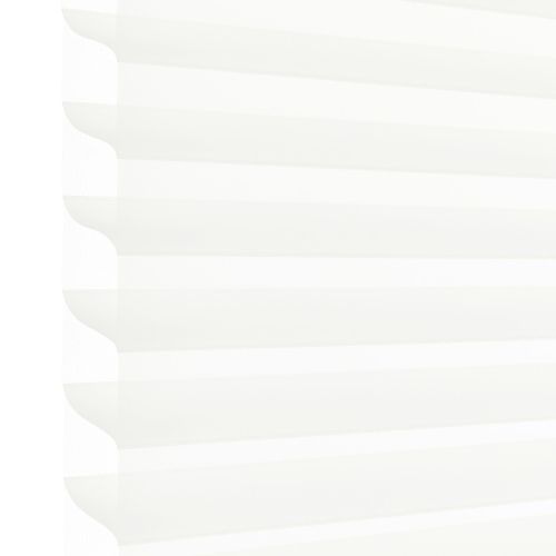 White pleated cellular blind with scalloped left edge, lowered and filtering soft daylight; occupies most of the frame, suggesting a bright interior with diffused light and no visible outside view.