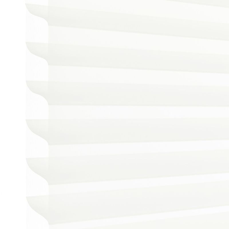 White pleated cellular blind with scalloped left edge, lowered and filtering soft daylight; occupies most of the frame, suggesting a bright interior with diffused light and no visible outside view.