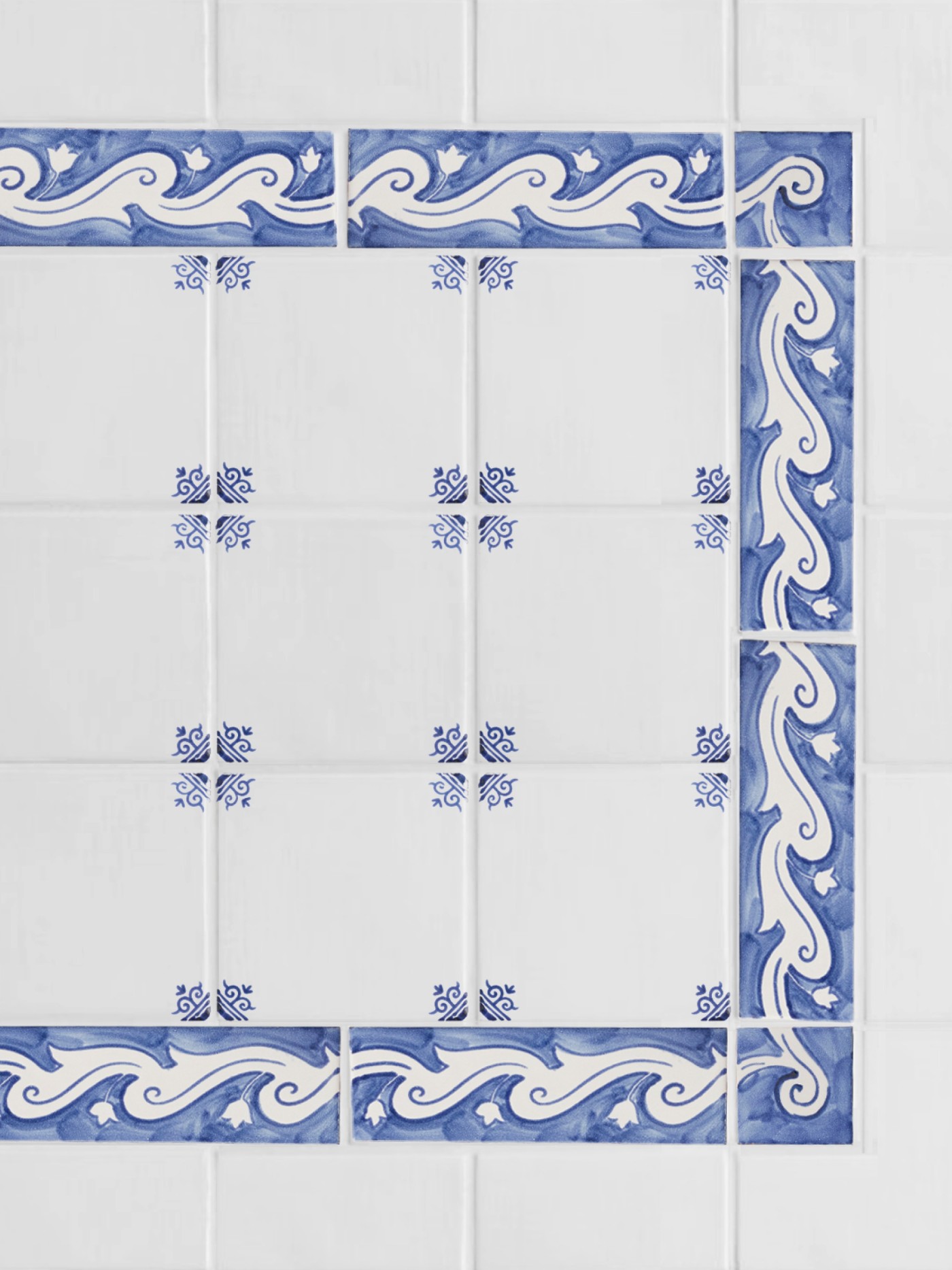 blue and white tiles arranged into an ornate border pattern.