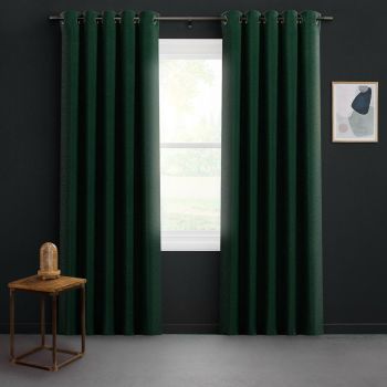 Dark green grommet-top curtains hang on a metal rod, parted to reveal bright daylight through the window; set against dark walls with a wooden side table and abstract framed art.