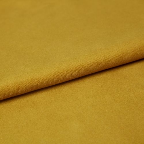 Mustard-yellow fabric, folded once with a visible textured edge, lying flat; soft pile catching even studio lighting, close-up composition emphasizing a smooth, plush surface.