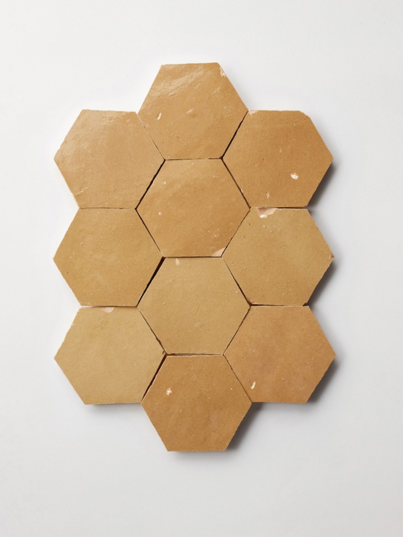 tan hexagonal tiles on a white background.