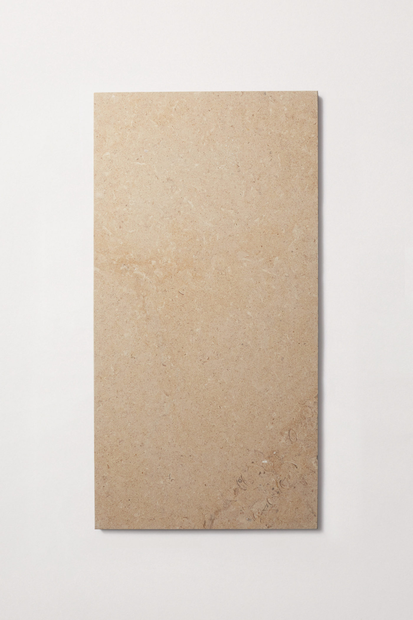 A large rectangle limestone tile on a white background.