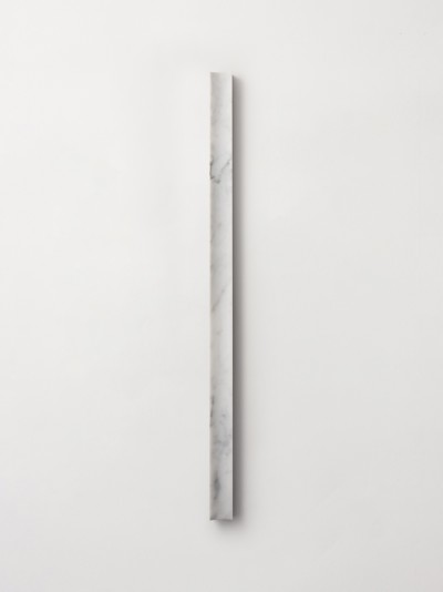 a white marble stick on a white wall.