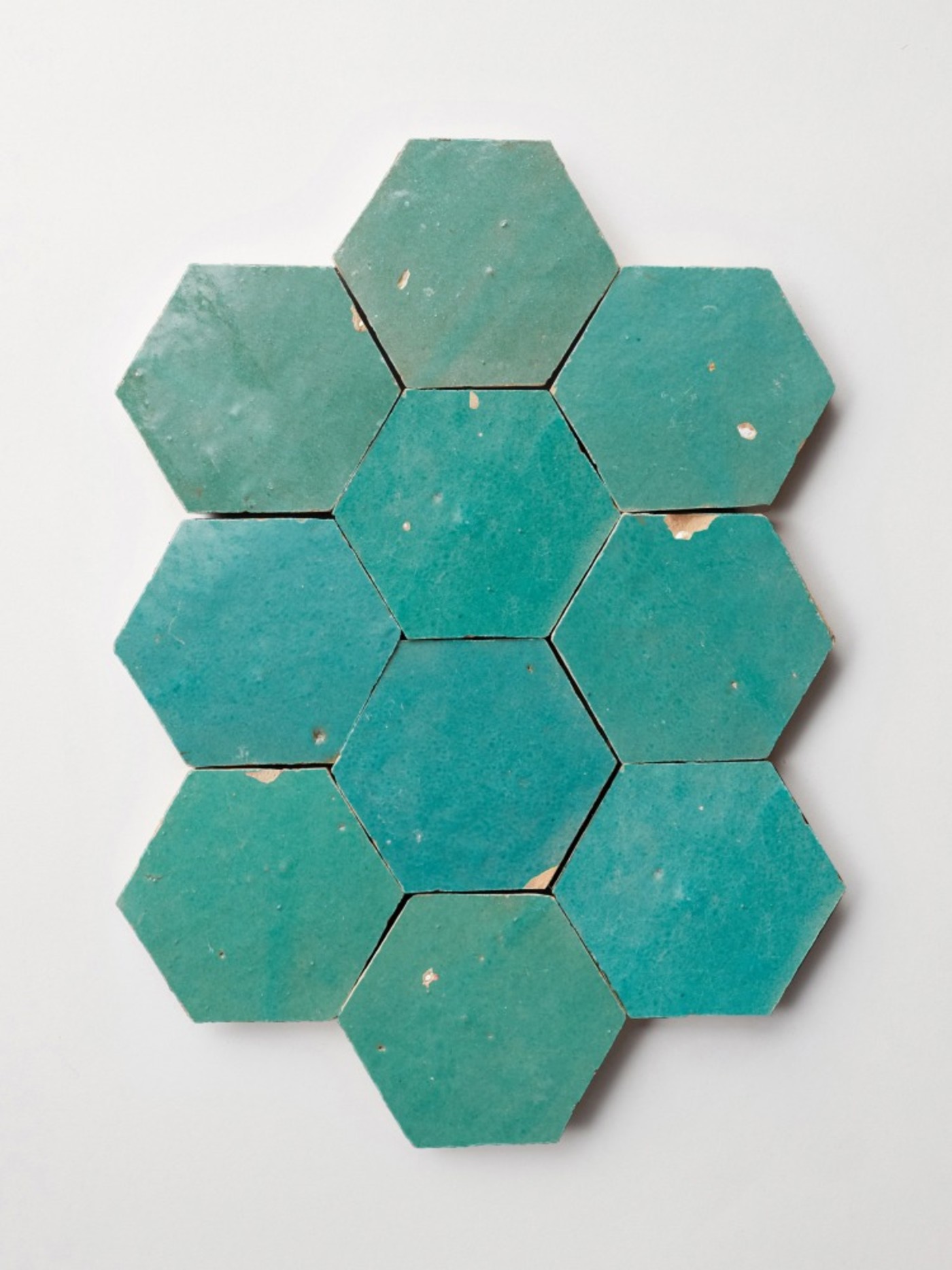 turquoise hexagonal tiles on a white background.