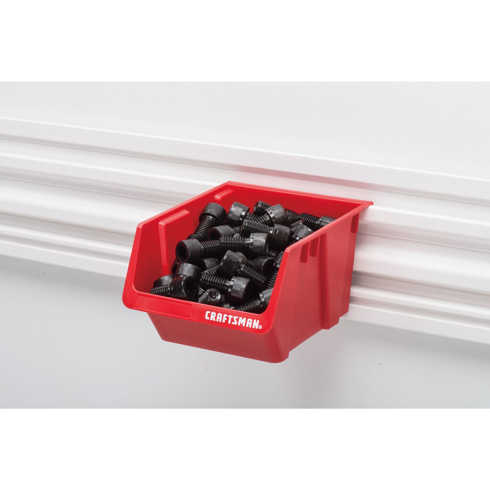 Single red VERSATRACK Bin filled with bolts attached to white VERSATRACK trackwall