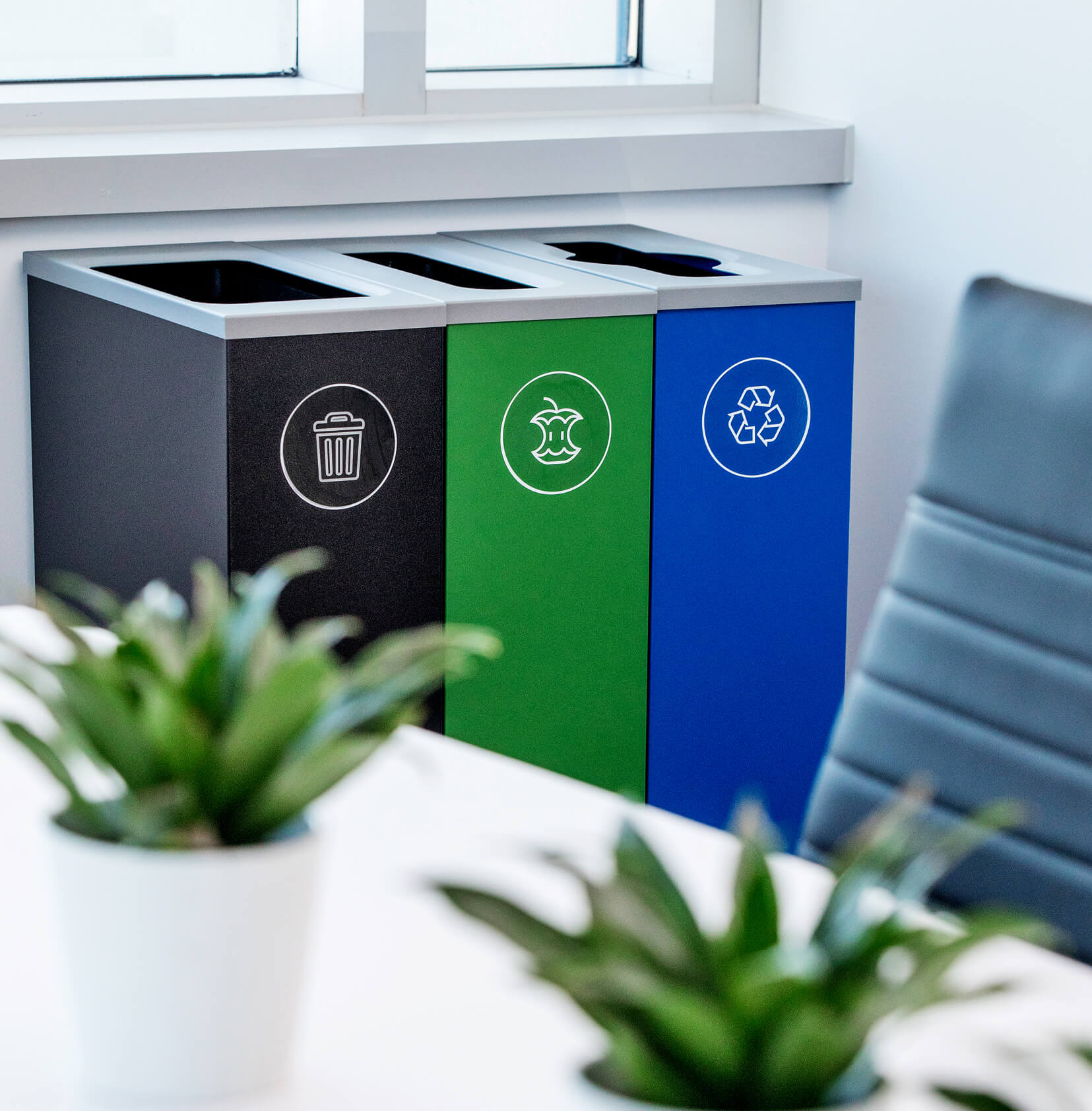 waste organics and recycling bins made from powder coated steel in a modern office meeting room