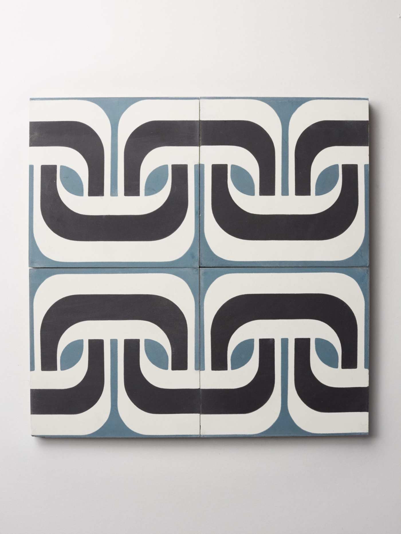 a set of blue and white tiles with black and white designs.