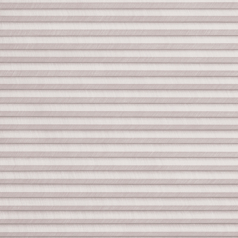 Horizontal pleated cellular blinds, full-width and fully lowered, pale blush textured fabric; closed and filtering soft diffuse light, concealing the window and creating a uniformly lit, neutral interior surface.