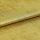 Gold metallic fabric with textured, slightly crushed nap, folded once across the frame; surface reflects light, showing shimmer and fine irregular grain, photographed under even studio lighting on flat backdrop.