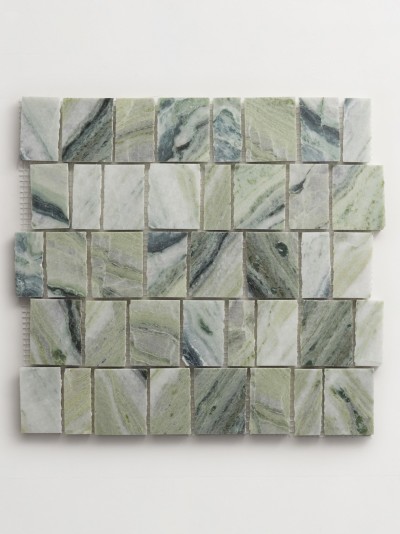 a green marble mosaic tile on a white surface.