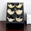 Six-compartment countertop flatware organizer with removable black perforated cylinders