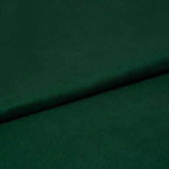 Deep emerald green felt fabric, folded once creating a soft overlapping seam; close-up studio view showing fine texture, matte finish, and even, subdued lighting.