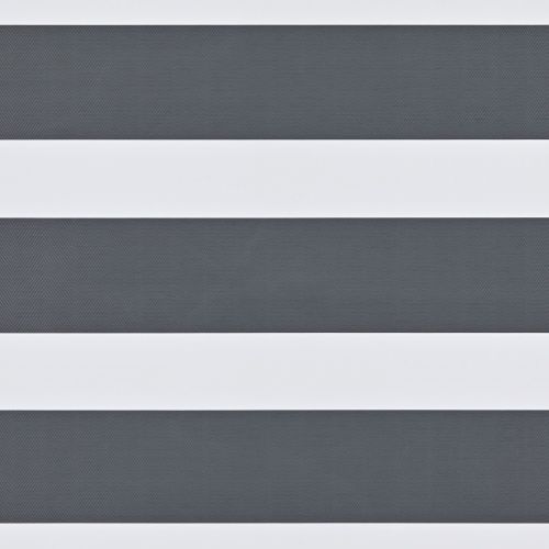Dual-layer zebra roller blind with wide opaque white bands and narrower textured dark-gray sheer stripes, mounted across a window; aligned to create alternating bands, partially filtering daylight in an interior.