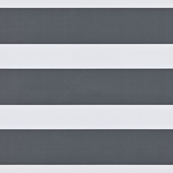 Dual-layer zebra roller blind with wide opaque white bands and narrower textured dark-gray sheer stripes, mounted across a window; aligned to create alternating bands, partially filtering daylight in an interior.