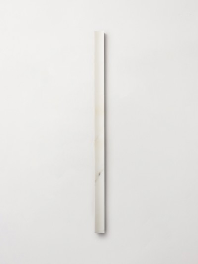 a white piece of wood on a white wall.