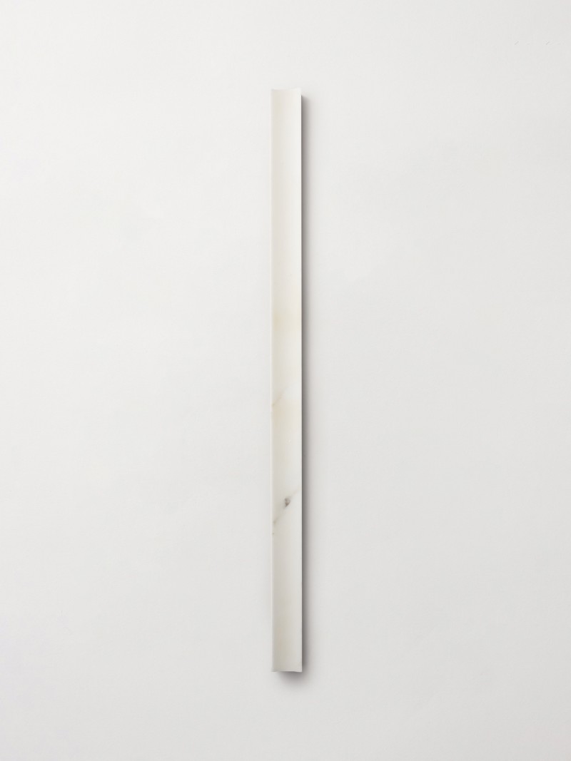 a white piece of wood on a white wall.