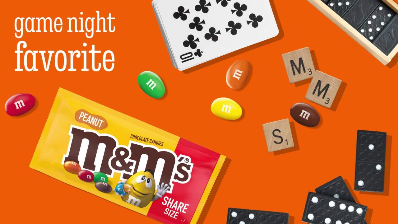 thumbnail video image 2 of M&M's Peanut Chocolate Football Candy, Share Size - 3.27 oz Pack, 2 of 13