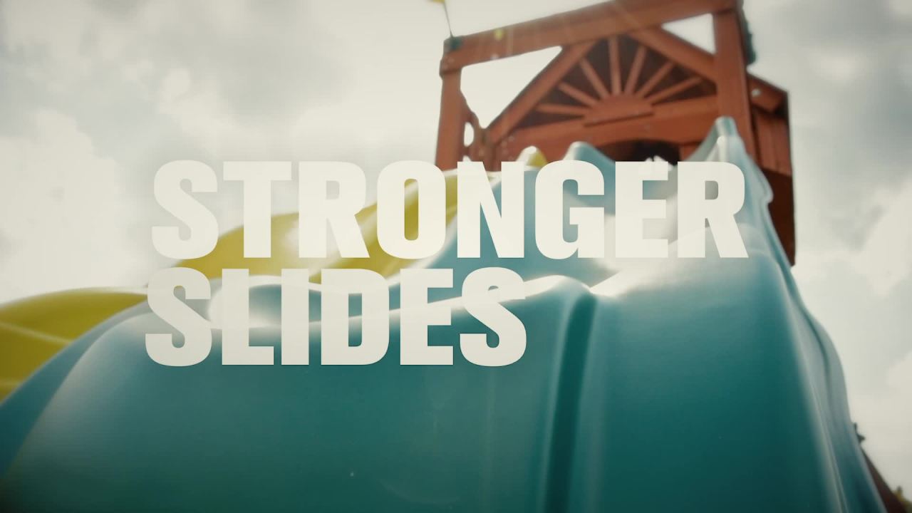 thumbnail video image 2 of Gorilla Playsets Navigator Wooden Swing Set with Green Vinyl Canopy, Monkey Bars, and Rock Climbing Wall, 2 of 13