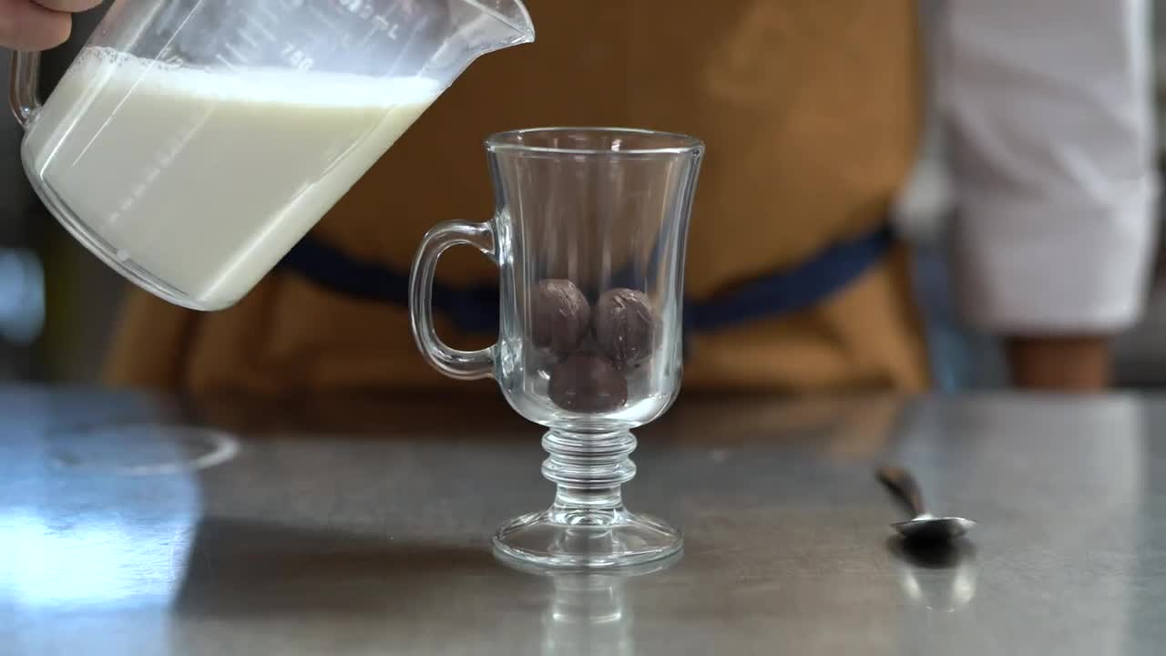 thumbnail video image 2 of Nestle Dark Chocolate Drink Stir In Powder Mix, 0.71 oz, 50 Packets, 50 Servings, 2 of 7