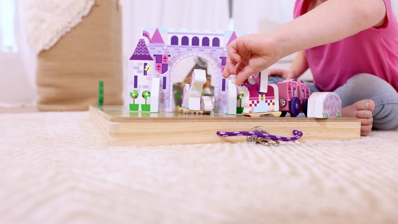 thumbnail video image 3 of Melissa & Doug 19-Piece Wooden Take-Along Tabletop Kingdom – Wood Play Pieces, Carriage, Horse, Unicorn, Dragon, Model Train Set, Toddler 3+, 3 of 11