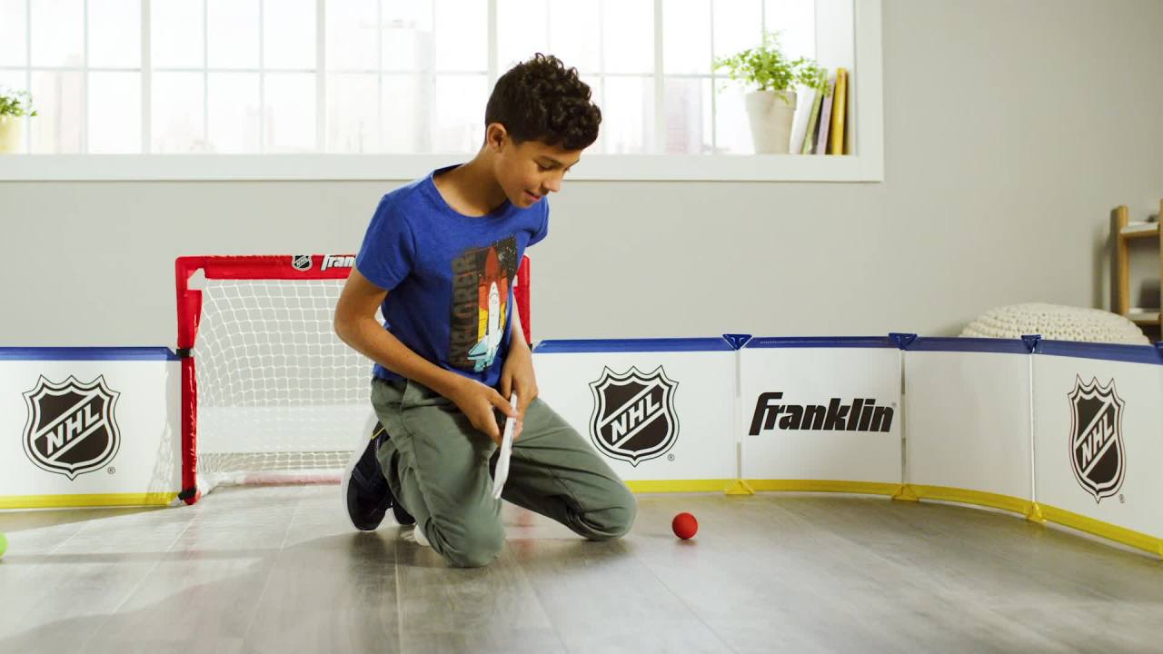 thumbnail video image 2 of Franklin Sports Mini Hockey Rink Set, Half Rink Knee Hockey Goal with Sticks and Ball, 15 Pieces, PVC, Official NHL Licensed, 2 of 3