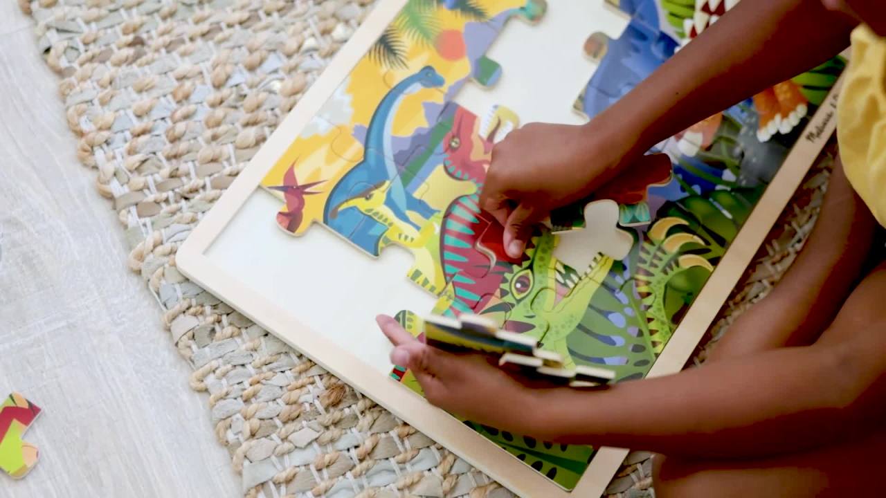 thumbnail video image 2 of Melissa & Doug Dinosaurs Wooden Jigsaw Puzzle With Storage Tray (24 pcs), 2 of 10