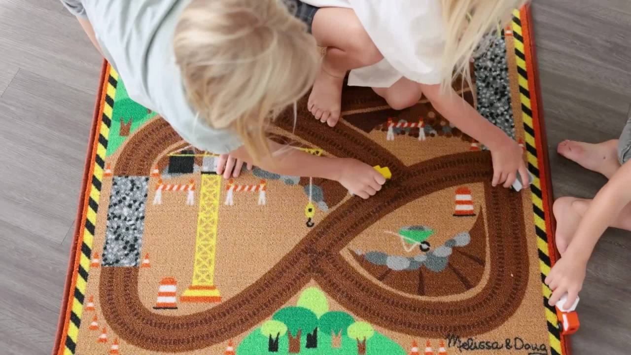 thumbnail video image 2 of Melissa & Doug Round the Construction Zone Work Site Rug With 3 Wooden Trucks (39 x 36 inches), 2 of 10
