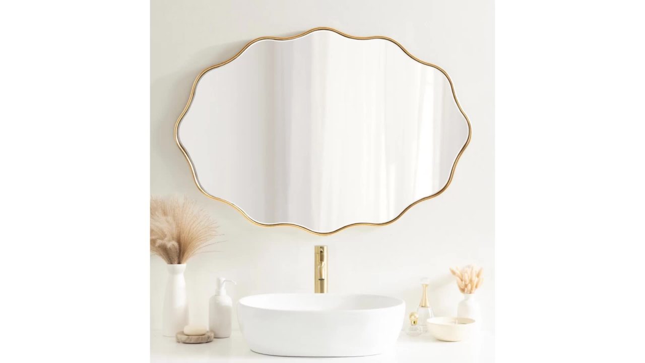 thumbnail video image 2 of Kate and Laurel Viona Modern Scalloped Oval Mirror, 24 x 34, Gold, Decorative Round Wall Mirror with Unique Rippled Edge and a Glamorous Gold Finish, 2 of 8