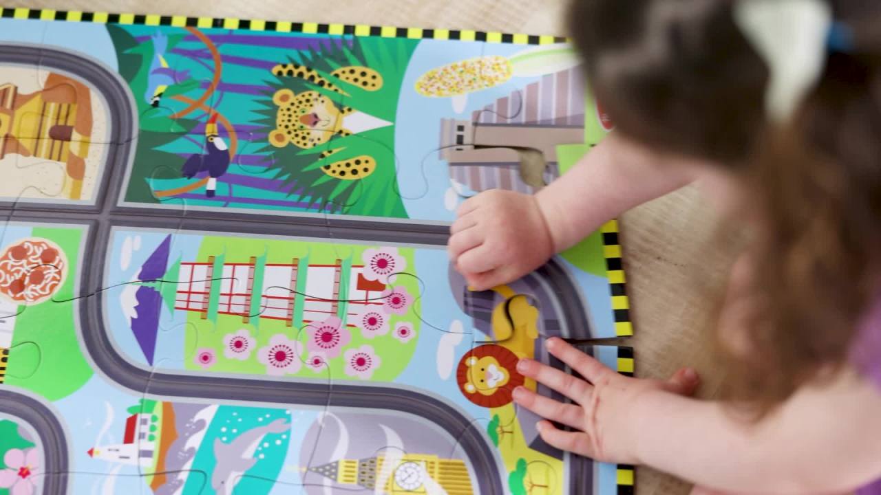 thumbnail video image 3 of Melissa & Doug Race Around the World Tracks Cardboard Jigsaw Floor Puzzle With Wind-Up Vehicles (48 Pcs) - FSC Certified, 3 of 12