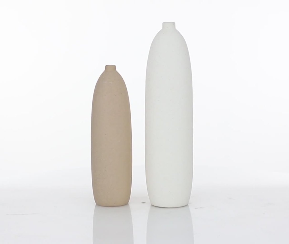 thumbnail video image 2 of DecMode 19", 15"H Tribal Easter Island Head Beige Ceramic Vase, Set of 2, 2 of 9
