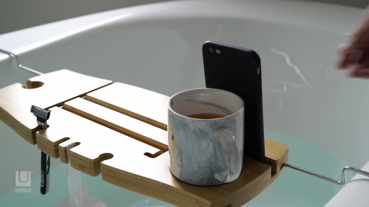 thumbnail video image 2 of Umbra Aquala Extendable And Adjustable Bamboo Bathtub Caddy, 2 of 16