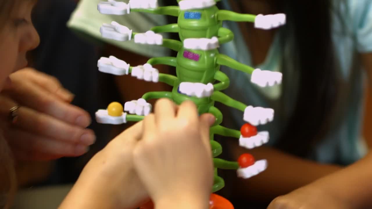 thumbnail video image 2 of Giggle Wiggle - the Twisting Turning Race to Get Your Marbles to the Top Game by Goliath, 2 of 8