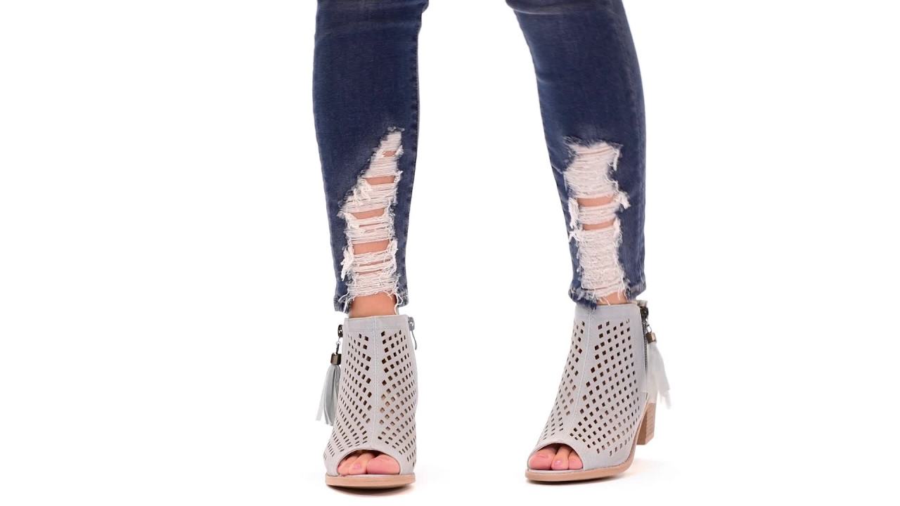 thumbnail video image 2 of Womens Laser Cut Faux Leather Tassle Booties, 2 of 7