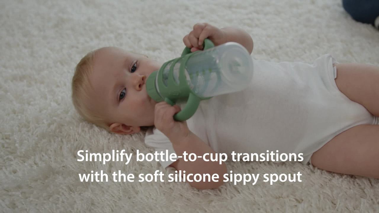 thumbnail video image 2 of Dr. Brown's Milestones Narrow Sippy Spout Bottle with 100% Silicone Handles, 8oz/250ml, 6m+, Light Blue & Gray, BPA Free, 2 Pack, 2 of 11