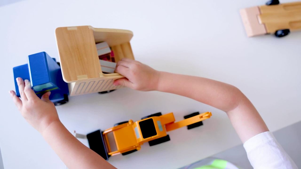 thumbnail video image 2 of Melissa & Doug Classic Toy Wooden Dump Truck & Loader with Construction Pieces, 2 of 10