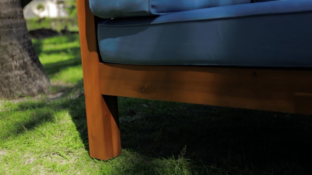 thumbnail video image 2 of Elisha Acacia Wood Outdoor Left Arm Loveseat and Coffee Table Set with Cushion, Teak and Blue, 2 of 14