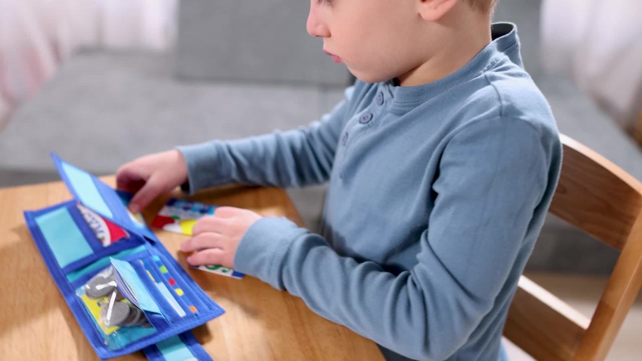 thumbnail video image 2 of Melissa & Doug Pretend-to-Spend Toy Wallet With Play Money and Cards (45 pcs), Blue - FSC Certified, 2 of 10