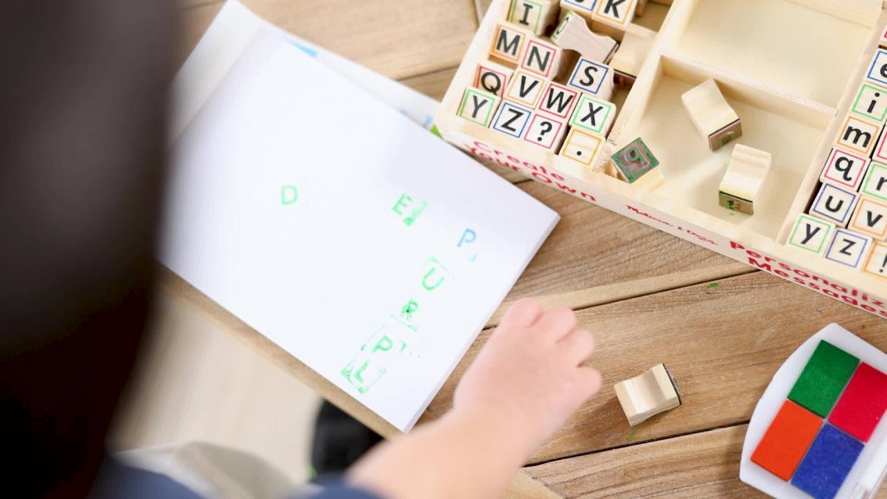 thumbnail video image 2 of Melissa & Doug Wooden Alphabet Stamp Set - 56 Stamps With Lower-Case and Capital Letters, 2 of 10