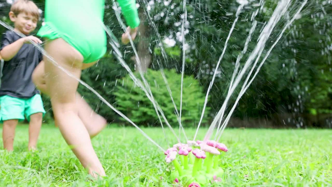 thumbnail video image 2 of Melissa & Doug Plastic Sunny Patch Pretty Petals Flower Sprinkler Toy with Hose Attachment, 2 of 10