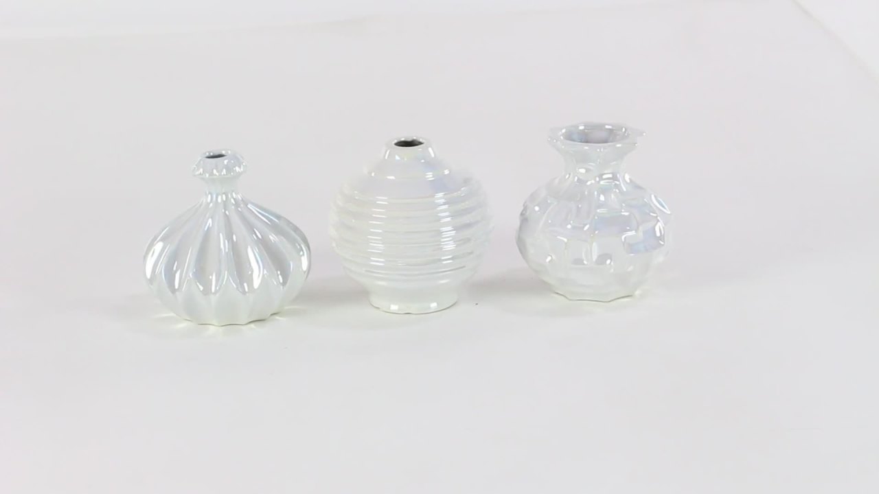 thumbnail video image 2 of DecMode 6"W, 6"H Cream Ceramic Vase with Varying Patterns, Set of 3, 2 of 6