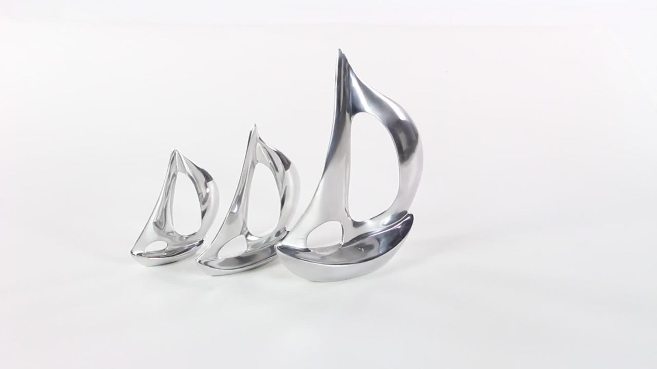 thumbnail video image 2 of 12", 8", 7"H Silver Aluminum Metal Sail Boat Sculpture, by DecMode (3 Count), 2 of 10