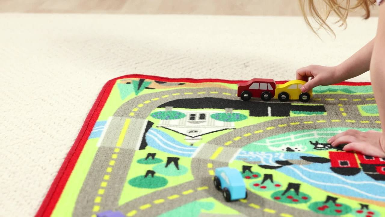 thumbnail video image 2 of Melissa & Doug Round the Town Road Rug and Car Activity Play Set With 4 Wooden Cars (39 x 36 inches), 2 of 10