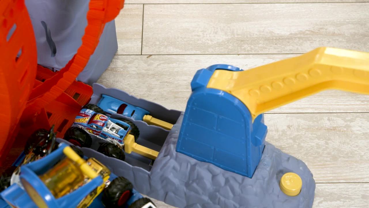 thumbnail video image 2 of Hot Wheels Monster Trucks T-Rex Volcano Arena Playset with 1 Toy Truck & 1 Toy Car, 2 of 6