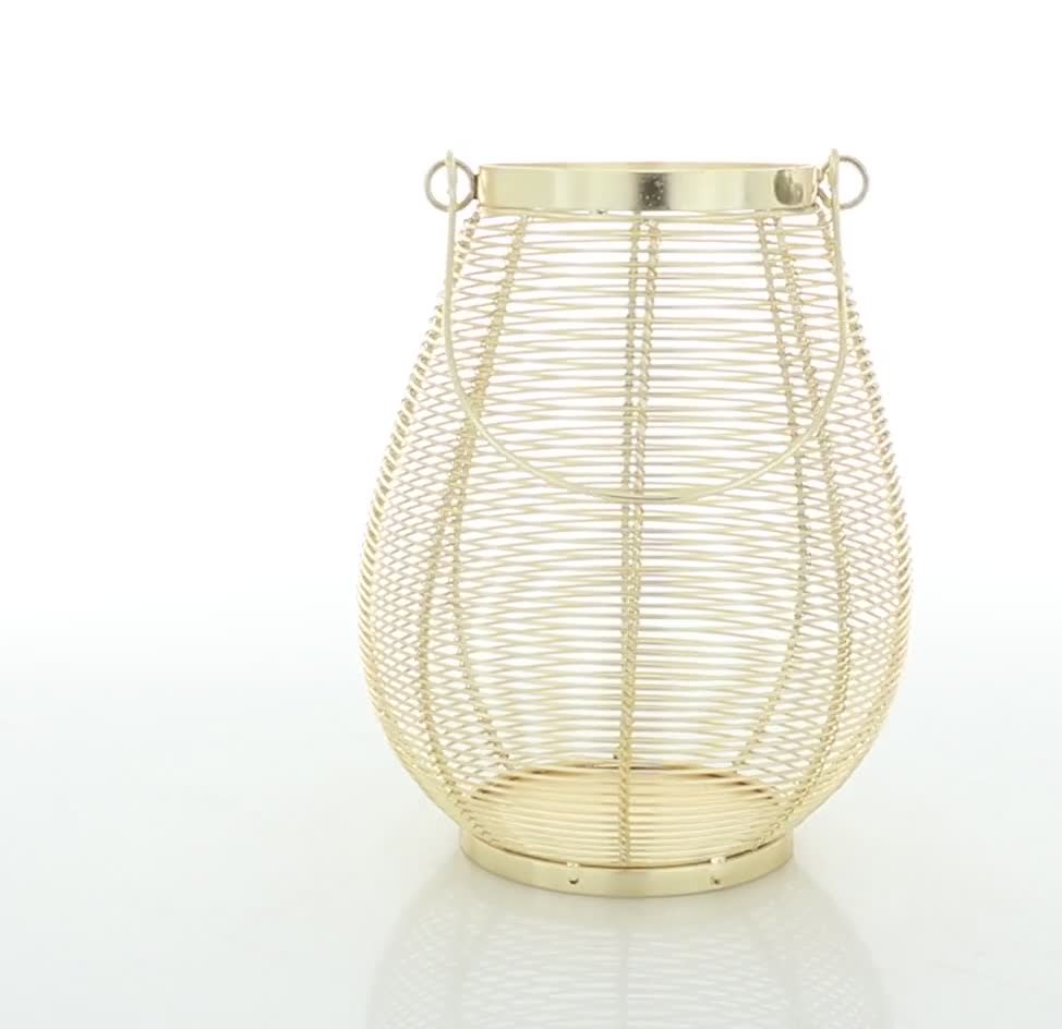 thumbnail video image 2 of DecMode Gold Metal Decorative Candle Lantern with Thin Metal Handle, 2 of 10