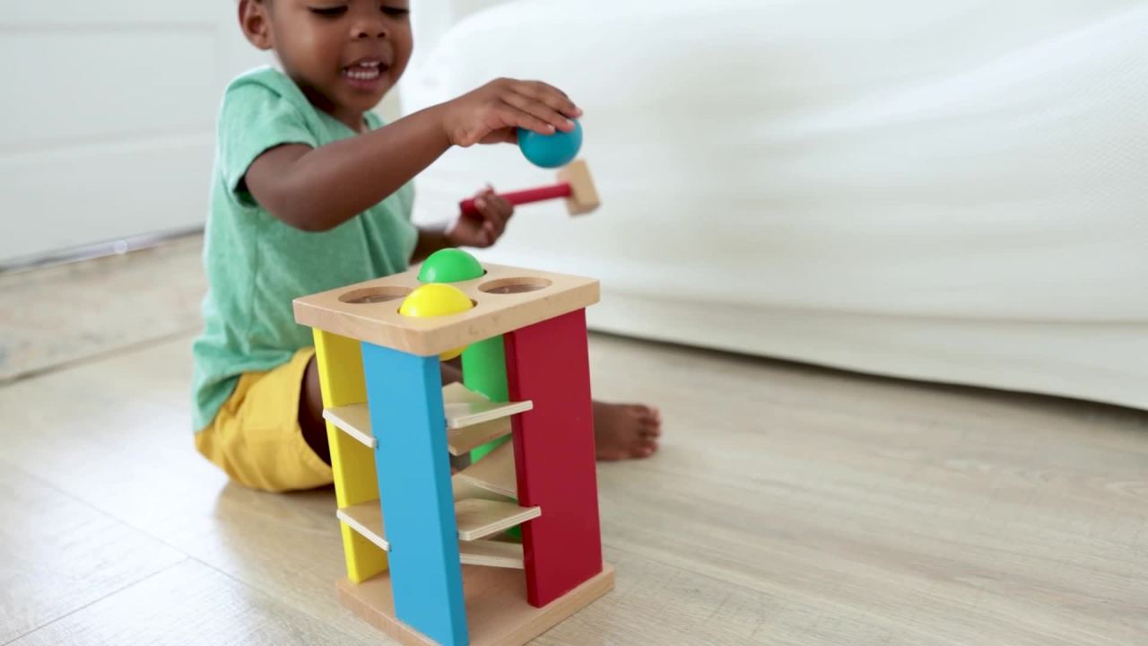 thumbnail video image 2 of Melissa & Doug Deluxe Pound and Roll Wooden Tower Toy With Hammer, 2 of 10