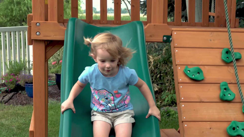 Gorilla Playsets Navigator Wooden Swing Set with Green Vinyl Canopy, Monkey Bars, and Rock